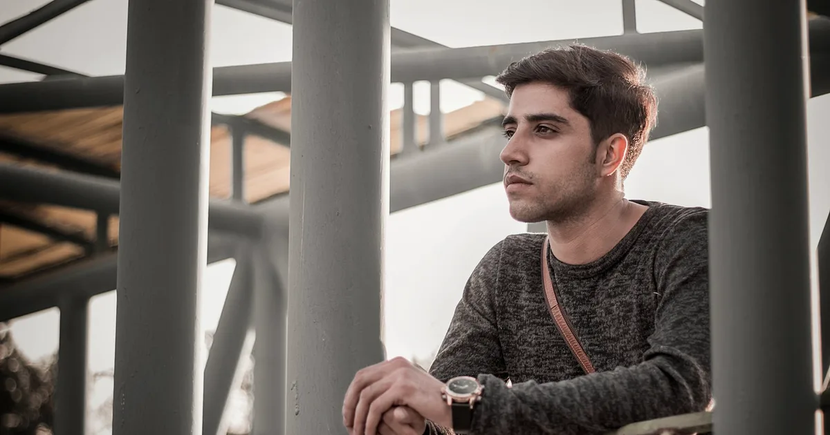 Young man gazing into the distance, an image of the scattered ADHD mind