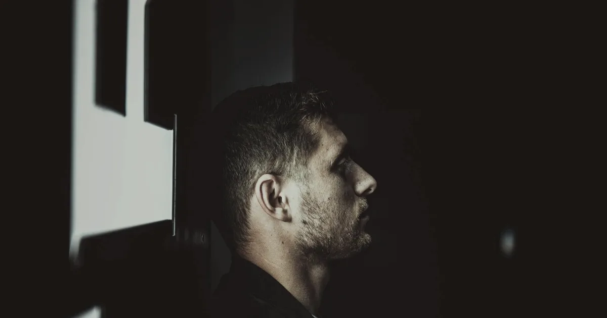 Dark side profile of a man, the emotional intensity that comes with ADHD symptoms
